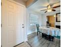 Well-lit dining room with a round table, modern light fixture, and neutral wall paint at 200 Country Club Dr # 202, Largo, FL 33771
