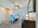 Dining room with modern accents, including a stylish buffet and eye-catching mirror at 200 Country Club Dr # 202, Largo, FL 33771