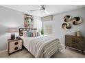 Cozy bedroom featuring a stylish accent wall, comfortable bed, and modern furnishings at 20214 Banner Ave, Port Charlotte, FL 33952