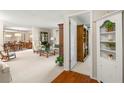 Spacious living room with neutral carpet, open floor plan, and easy access to other living areas at 214 Caryl Way, Oldsmar, FL 34677