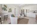 Cozy seating area with a bar, stainless steel appliances, and modern decor at 2238 Stratten Dr, Zephyrhills, FL 33541