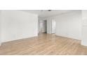 Spacious living room with light hardwood floors and neutral walls at 3953 10Th S Ave, St Petersburg, FL 33711
