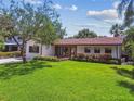 Lovely single-story home featuring a well-manicured lawn, mature landscaping, and a serene suburban setting at 4522 S Hale Ave, Tampa, FL 33611
