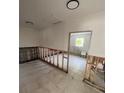 Renovation stage of a room showcasing tiled floors, and exposed studs ready for customization at 6000 Denver Ne St, St Petersburg, FL 33703