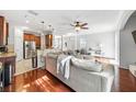 Open concept living area with hardwood floors and a comfortable couch at 7001 Interbay Blvd # 192, Tampa, FL 33616
