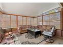 Relaxing sunroom with comfortable seating, natural light, and neutral tones, perfect for unwinding at 7676 18Th St N, St Petersburg, FL 33702