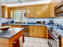 Well-maintained kitchen featuring granite counters, stainless steel appliances, and ample cabinet space at 100 Bluff View Dr # 114C, Belleair Bluffs, FL 33770