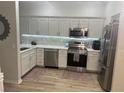Modern kitchen with stainless steel appliances and ample cabinet space at 1050 Starkey Rd # 106, Largo, FL 33771