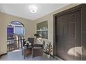 Inviting porch with tiled floor, seating area, and view of the front yard at 1206 E Osborne Ave, Tampa, FL 33603