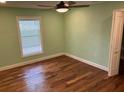 Cozy bedroom with hardwood floors, natural light and a relaxing atmosphere at 206 Hillcrest Dr, Safety Harbor, FL 34695