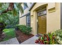Inviting home exterior with a well-kept lawn and a charming front door and entryway at 27563 Pleasure Ride Loop, Wesley Chapel, FL 33544