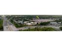 A birds eye view showcasing a condominium community and its proximity to a highway and local businesses at 4030 Cortez Dr # C, Tampa, FL 33614