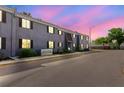 Exterior view of a well-maintained apartment building with dark brown shutters under a colorful evening sky at 4030 Cortez Dr # C, Tampa, FL 33614