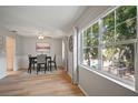 Bright dining area with pool views, lovely floors, and a contemporary table and chair set at 4325 Aegean Dr # 250B, Tampa, FL 33611
