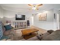 Cozy living room with neutral paint colors and light colored floors offering a relaxing space to unwind at 4325 Aegean Dr # 250B, Tampa, FL 33611