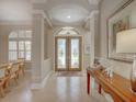 Welcoming foyer featuring double doors and an adjacent dining area at 4335 Clairidge Way, Palm Harbor, FL 34685