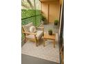 Cozy balcony with outdoor seating and privacy wall at 4411 Shady Terrace Ln # 213, Tampa, FL 33613
