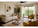 Bright living room featuring a ceiling fan, comfortable seating, and sliding door to a balcony at 4411 Shady Terrace Ln # 213, Tampa, FL 33613