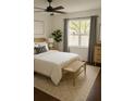Comfortable bedroom with a ceiling fan, bench, and ample natural light at 4411 Shady Terrace Ln # 213, Tampa, FL 33613