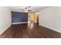 Bright and airy living room featuring hardwood floors and a ceiling fan, perfect for relaxing or entertaining guests at 5210 Dr Martin Luther King Jr St N St, St Petersburg, FL 33703
