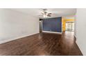 Spacious living room featuring hardwood floors and neutral-toned walls, creating a blank canvas for personalization at 5210 Dr Martin Luther King Jr St N St, St Petersburg, FL 33703