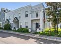 Beautiful townhome with eye-catching architectural features, lovely landscaping, and a convenient sidewalk nearby at 5528 Liberty Plain Cir, Tampa, FL 33611
