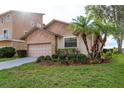 Well-maintained exterior with lush landscaping and palm trees, complemented by the charming home design at 6340 Garland Ct, New Port Richey, FL 34652