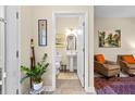 Hallway view leading to a convenient half bathroom at 6934 Duffy Ln, Tampa, FL 33616