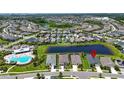 An aerial view showing the home's location within a community with access to a lake and pool at 7116 Estero Ct, Apollo Beach, FL 33572