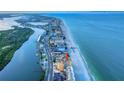Aerial view of a beachfront condo, showcasing its prime location and proximity to the ocean and inter-coastal waterway at 18610 Gulf Blvd # 607, Indian Shores, FL 33785