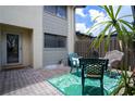 Outdoor patio with furniture, decorative rug, and privacy fence is perfect for entertaining or relaxing at 1933 Whitney Way, Clearwater, FL 33760