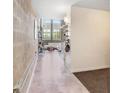 Concrete floors, white sofa, metal and wood decor inside the living room at 2001 E 2Nd Ave # 37, Tampa, FL 33605