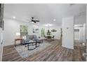 Bright and airy living room features modern decor, sleek flooring, and ample space for entertaining and relaxation at 2326 Auburn S St, St Petersburg, FL 33712