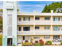 Charming multi-story condo building featuring a unique facade and a welcoming coastal design with a bright, airy feel at 2330 Ecuadorian Way # 30, Clearwater, FL 33763
