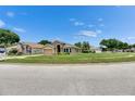 A well-maintained single-story home nestled on a spacious, landscaped lot at 25327 Seven Rivers Cir, Land O Lakes, FL 34639