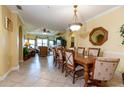 Spacious dining room offers a view of the living room, complete with elegant furnishings and natural light at 2724 Via Murano # 639, Clearwater, FL 33764