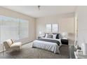 Serene main bedroom features large window, neutral decor, and plush carpeting for a relaxing retreat at 3406 Dragon View Ct, Valrico, FL 33594