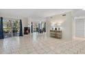 Open living room layout with a fireplace and sliding door access to the outdoors at 4777 Duhme Rd # 1D, St Petersburg, FL 33708