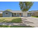 Charming single-story home with a well-maintained lawn and attached one car garage at 5860 99Th N Ave, Pinellas Park, FL 33782