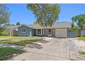 Charming single-story home with a well-maintained lawn and attached one car garage at 5860 99Th N Ave, Pinellas Park, FL 33782
