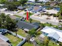 Aerial view of home displaying a backyard with a white privacy fence and neighborhood street view at 621 Gran Kaymen Way, Apollo Beach, FL 33572