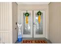 A charming front door, decorated with festive wreaths, that welcomes visitors at 10902 Bent Tree Pl, Tampa, FL 33618