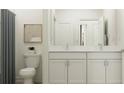 Bright bathroom featuring double sinks, granite countertops, and stylish fixtures at 11740 E 71St Ave, Palmetto, FL 34221