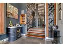 Hallway with decorative wallpaper, liquor cabinet, and wine rack at 1501 W Horatio St # 101, Tampa, FL 33606