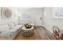 Cozy living room showcasing natural light, wood floors and a comfortable aesthetic at 2044 Balfour Cir, Tampa, FL 33619