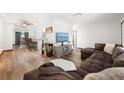 Spacious living room with hardwood floors and a comfortable seating area at 5533 Golden Nugget Dr, Holiday, FL 34690