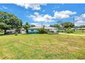 Expansive front yard view of the well-maintained exterior of this charming home at 6195 28Th N Ave, St Petersburg, FL 33710