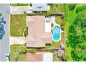 Aerial view showing home, pool, patio, and privacy fence at 11082 90Th Ter, Seminole, FL 33772