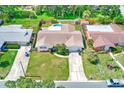Aerial view of home with fenced yard and pool surrounded by lush landscaping at 11082 90Th Ter, Seminole, FL 33772