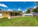 Spacious backyard with a pool and screened-in patio, great for entertaining and relaxing outdoors at 11398 88Th Ave, Seminole, FL 33772